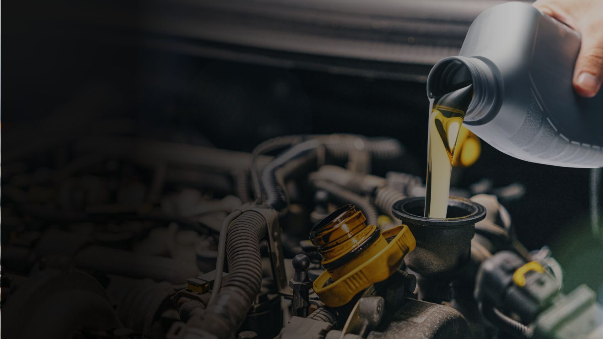 A photo with a background of a mechanic changing the car oil.